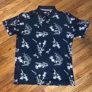 Medium Puma polo shirt with feather pattern.